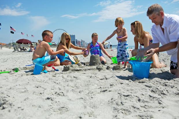 Family at The Beach building sandcastle, Myrtle Beach, SC