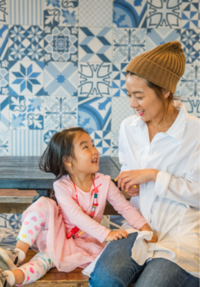 Mother and daughter in pastry shop