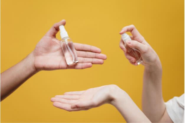 People holding glass bottles