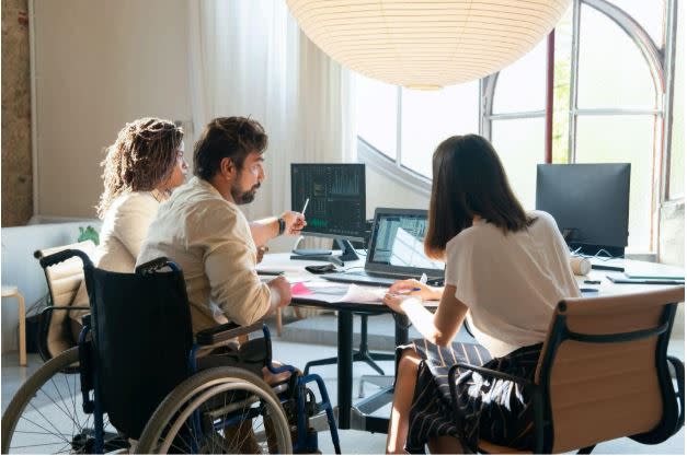 People in workspace talking