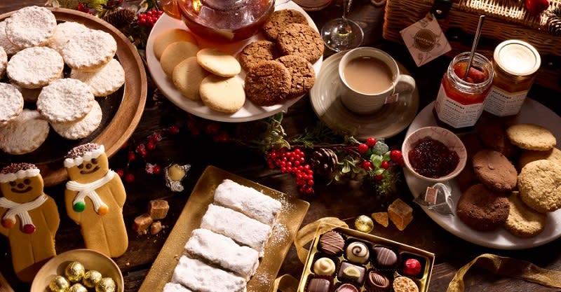 A table covered with delicious goods from Huffkins including mince pies, chocolates and gingerbread men
