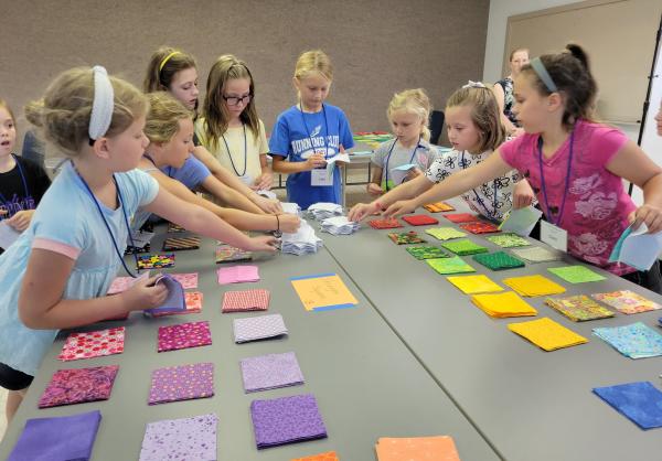 Kids learning to quilt