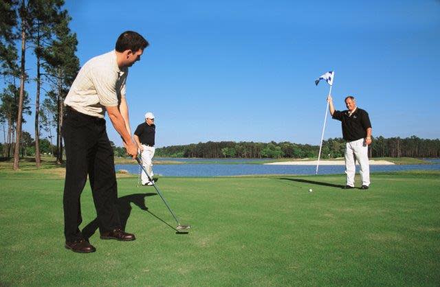 Group Of Men Enjoying One Of Northshore's six scenic golf courses
