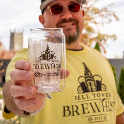 Man holding brew fest cups