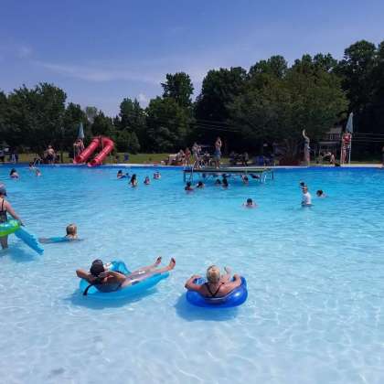 People flaoting and swimming in Blue Waters Pool