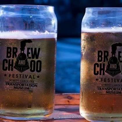Two cups of beer with Brew and Choo logo on them
