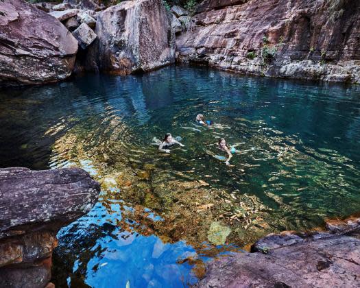 children in swimming hole on walk trail to emma gorge tourism western australia