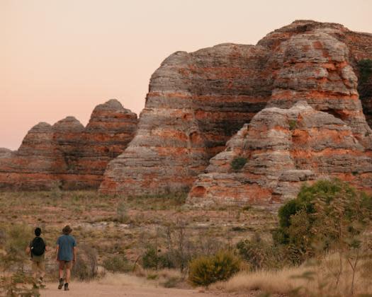 Two men walking at the domes in Purnululu National Park Tourism Western Australia