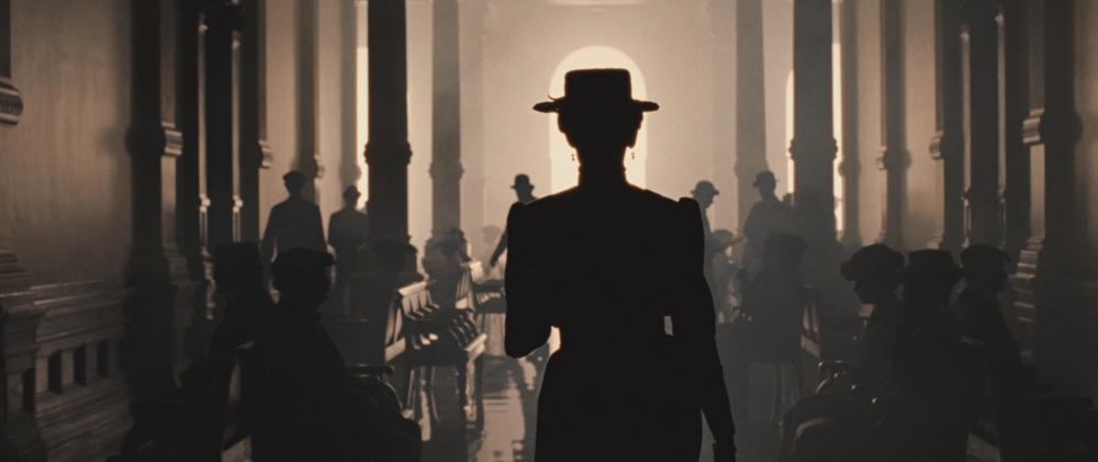 True Grit screengrab showing the silhouette back of a woman inside the Memphis Train Station