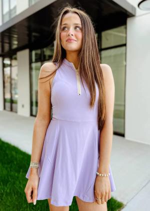 Woman in Lavender Athletic Dress from Swank