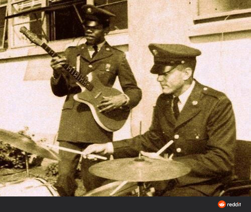 guitarist and drummer in Army uniforms