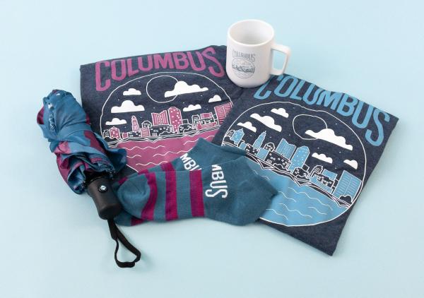 Merch as part of CBUS Rewards program, including Columbus shirts, mug, umbrella and socks