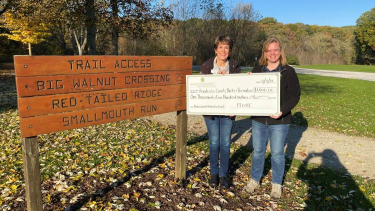 PFOHC board member Carol Wood presents a grant to be used at McCloud Nature Park