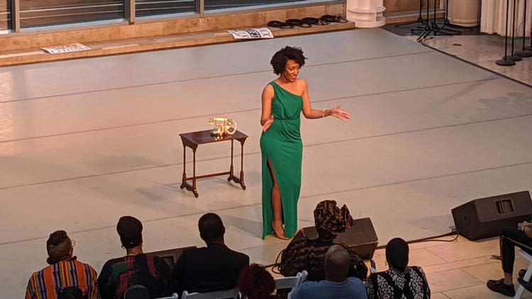 Art & Soul speaker on stage, green dress
