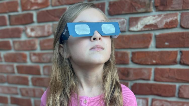 Viewing the eclipse with protective glasses