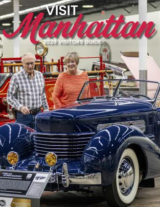 Cover of the 2026 Manhattan Visitor Guide at the Midwest Dream Car Collection.