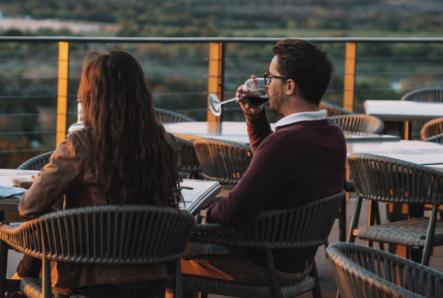 couple drinking on a balcony