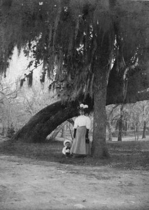 A woman and child pose under Founders Oak in Landa Park in New Braunfels, circa 1900.