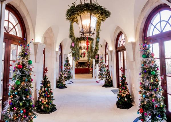 christmas trees adorn hallway