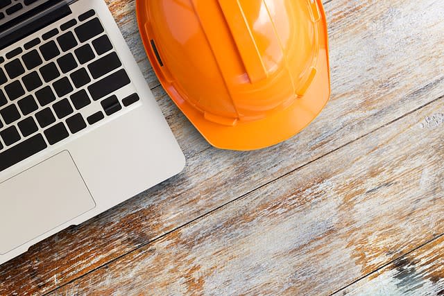 picture of a laptop and hard hat