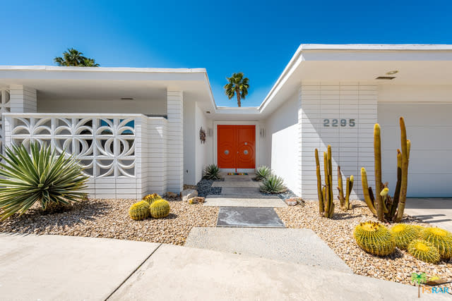 Tangerine orange colored door at 2295 S Alhambra Drive