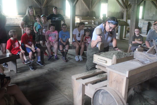 Children watch a demo at Hopewell Furnace