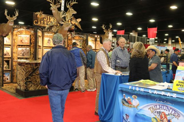 People visiting exhibitions at a show in the Mountain America Expo Center