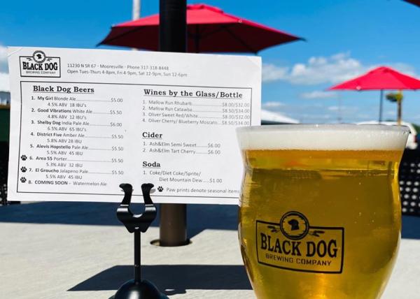 Enjoy locally crafted brews, plus wine and cider, on the patio at Black Dog Brewing Company in Mooresville.