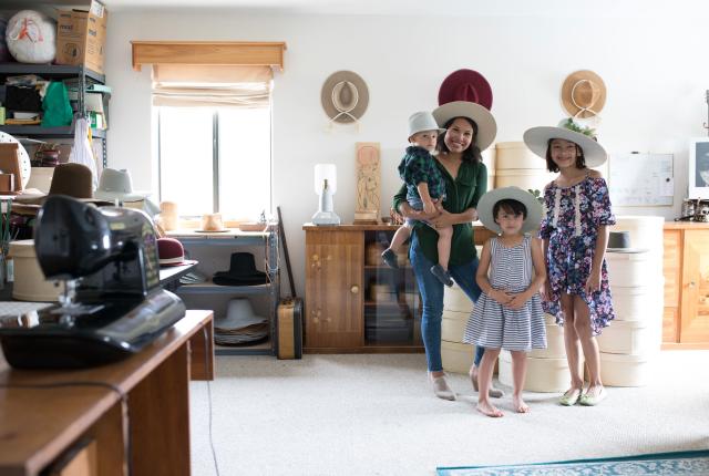 Jessi Lloyd and her children in her hat studio