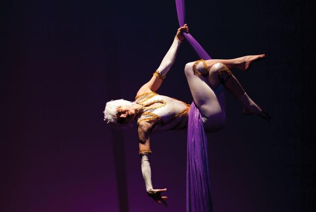 Amy Christian performs on aerial silk during a Circus Luminous production