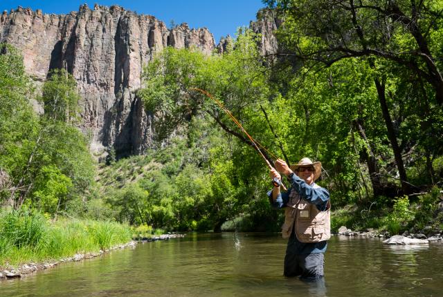 An angler enjoys fishing in the Gila River.