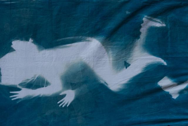 A print of a woman's figure lying on her side