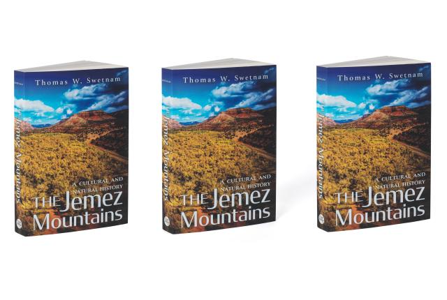 Cover of "The Jemez Mountains: A Cultural and Natural History" by Thomas W. Swetnam, featuring a mountain scene with golden grasses.