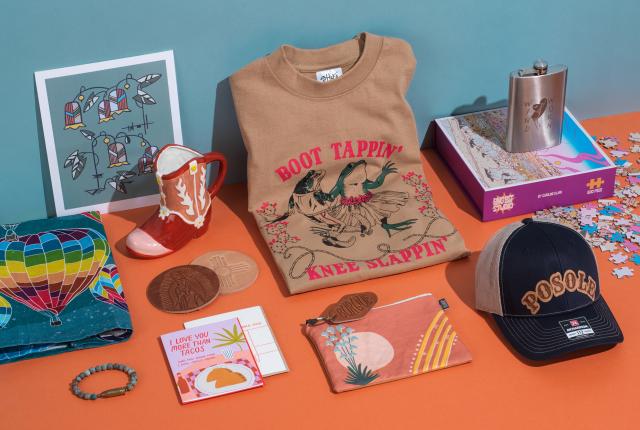 Jen Fox Studio print, $22; Cowboy boot mug, $20; Tres Cuervos embossed coasters, $7 each; Windworn T-shirt, $30; Long Lost Studio puzzle, $38; Windworn flask, $18.50; Tres Cuervos hat, $32; Jen Fox Studio zipper pouch, $32; Tres Cuervos motel key chain, $12.50; Odd Daughter Paper Co. greeting cards, $6 each; Tres Cuervos cuff, $85; Jen Fox Studio hot-air-balloon tea towel, $18.