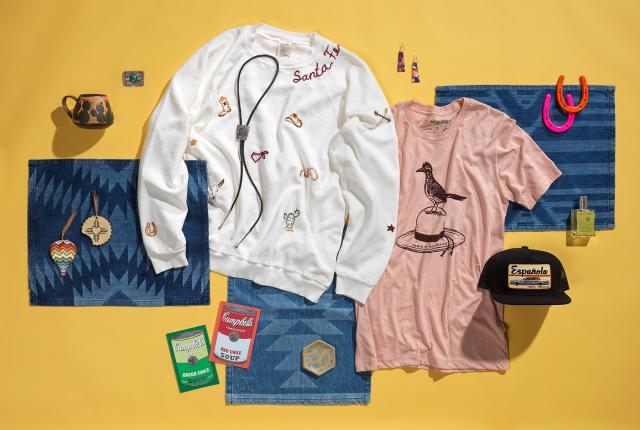 Collection of souvenirs and goods from Black Diamond Curio in Santa Fe, including T-shirts, jewelry, hats, ornaments, and ceramic.