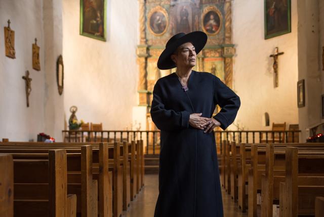Nacha Mendez stands in Santa Fe’s San Miguel Chapel, the oldest church in the continental United States.
