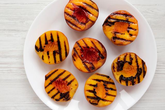 Plate of grilled peaches.