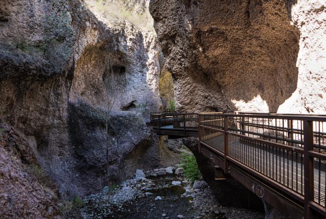 The Catwalk National Recreation Trail leads hikers through towering canyon walls.