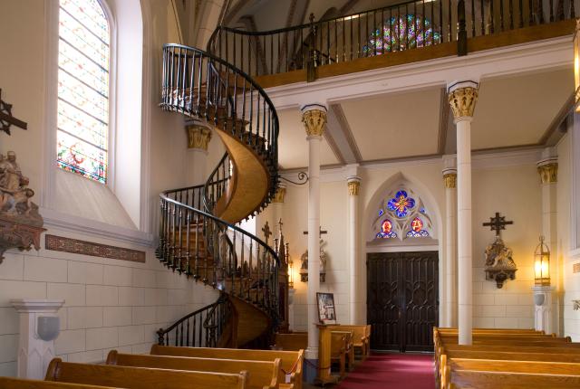 Photo of the spiral wooden staircase at Santa Fe's Loretto Chapel, known for its design with no visible supports.