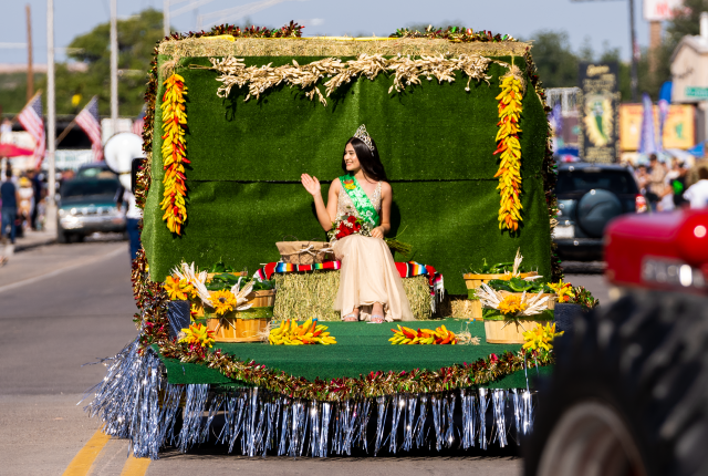 The Green Chile Queen waves to the crowd during the Hatch Chile Festival parade.
