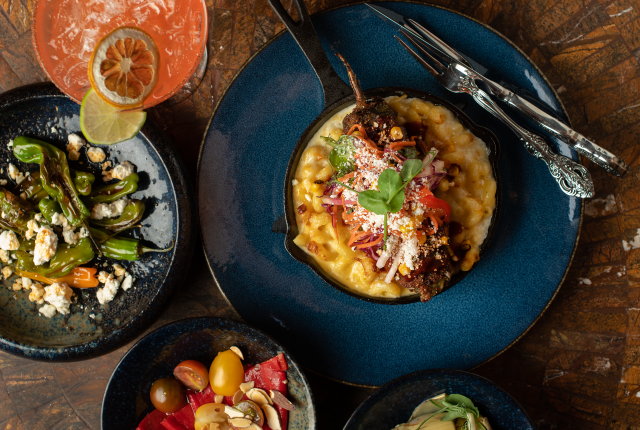 At De La Tierra, in Taos, chef Cristina Martinez’s rellenos are stuffed with pulled pork and served on a bed of mac and cheese
