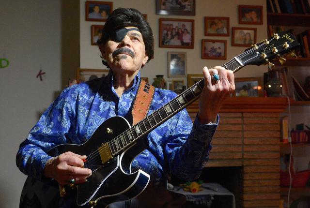 Al Hurricane tunes his guitar in 2016, a defining figure in New Mexico music.