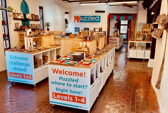 Puzzled encourages shoppers to hang out and play a game of pegboard checkers or attempt to escape the Crazy Loops Handcuffs.