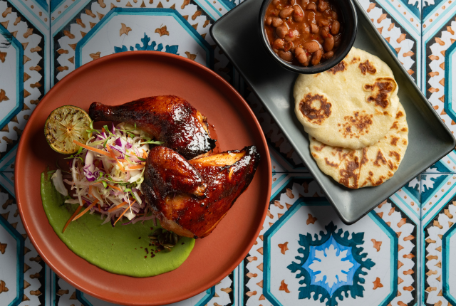 At Mesa Provisions, the smoked half chicken is glazed in red chile honey.