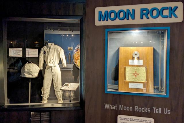 A moon rock from the Taurus-Littrow Valley, symbolizing Robert H. Goddard's pioneering work in rocket propulsion, is displayed at the Roswell Museum.
