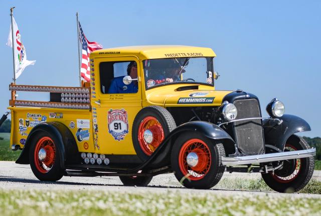 Vintage yellow race truck from The Great Race parked outdoors, representing the historic car rally travelling through New Mexico.