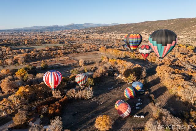 Colorful hot-air balloons rise over the Rio Grande Valley during the Rio Grande Sky Fiesta.