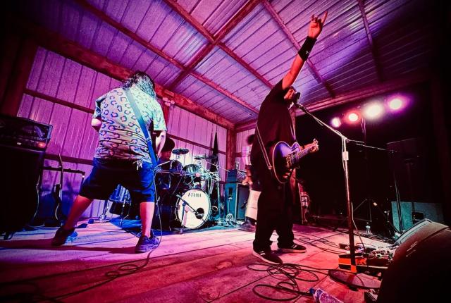 Members of the Navajo Nation band Testify perform onstage.