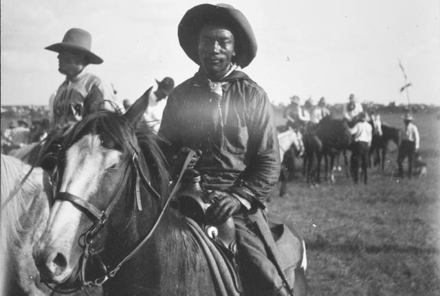 African American and Cherokee rodeo pioneer Bill Pickett invented steer wrestling. Photo by Fred S. Bard, circa 1910.