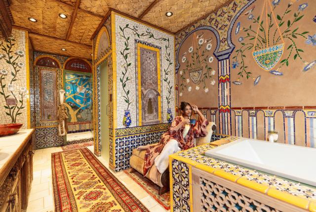 The bathrooms at the Inn of the Five Graces feature a walk-in shower, soaking tub, and a mesmerizing display of colors, shapes, and textures.